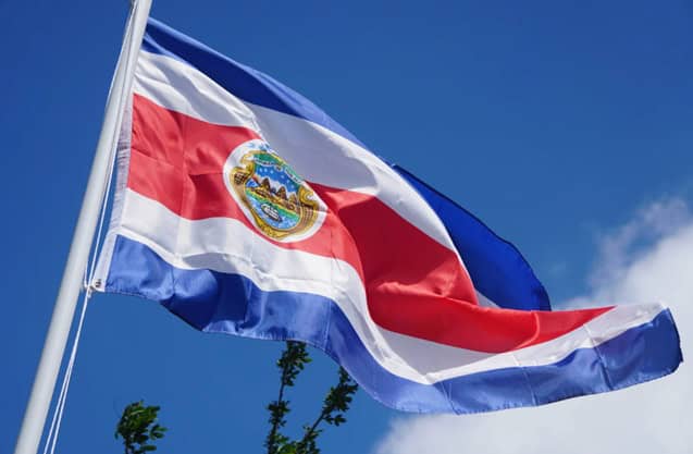 Costa rican flag waving in the wind with the sky in the background