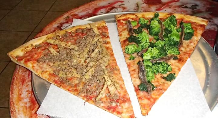 Large New York-style pizza slices from Times Square Pizza
