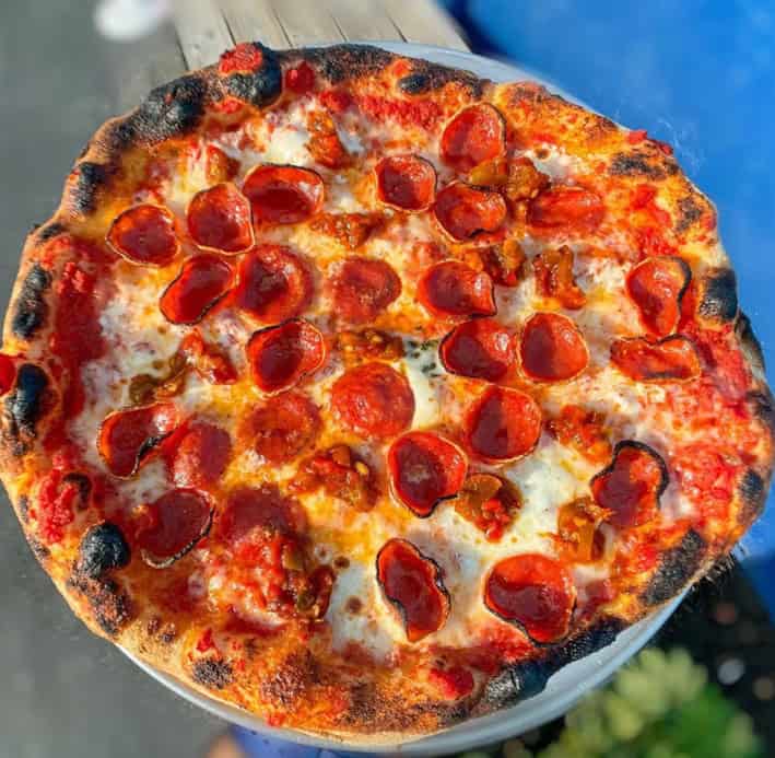 Pepperoni pizza from Pizzeria Magaddino with charred edges and pepperonis